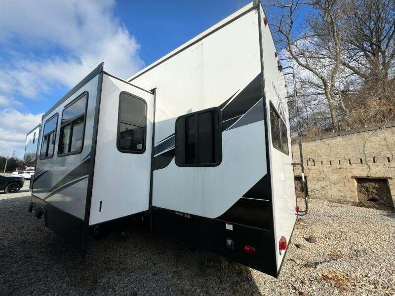 Side view of the RV with slide outs.