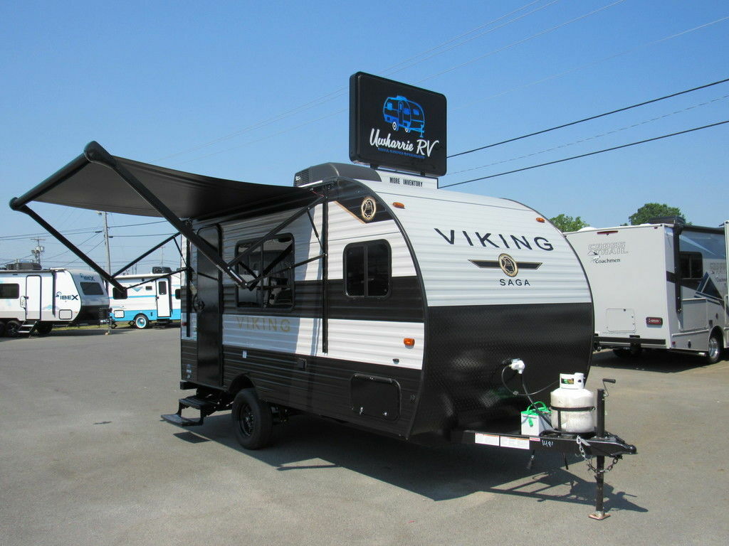 Side view of the RV with an awning.