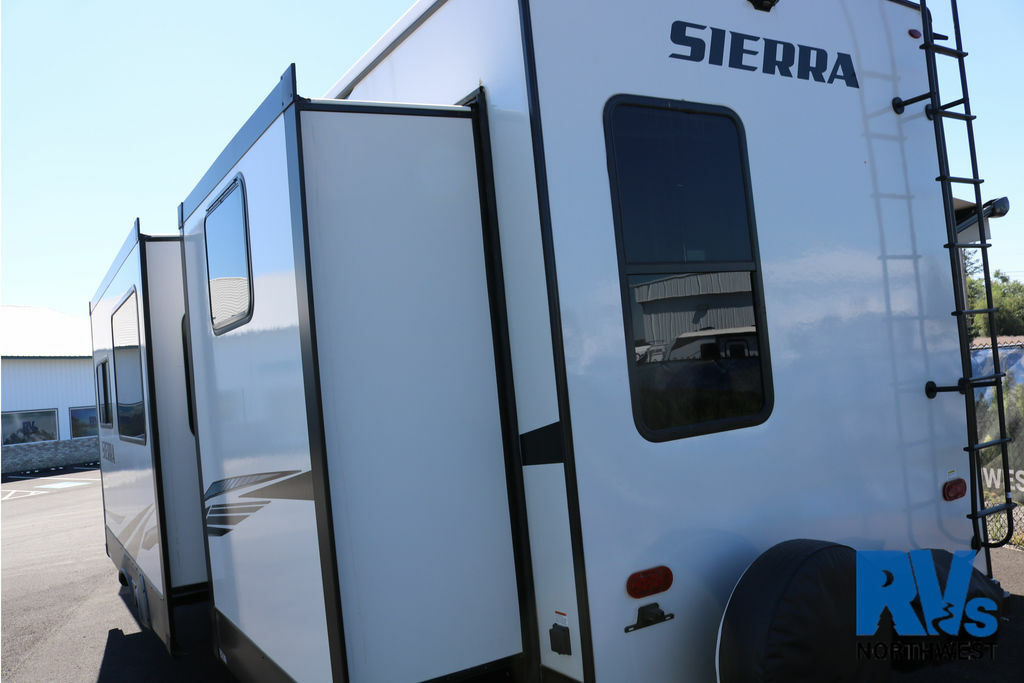 Rear view of the RV with a slide out