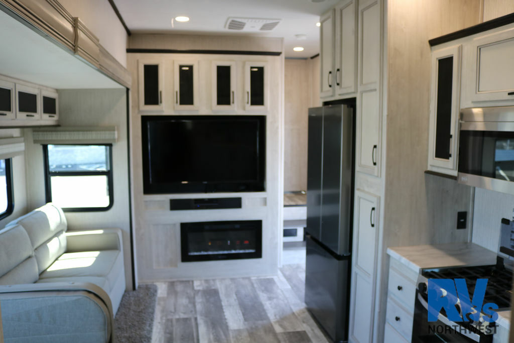 Interior view of the RV with a living space and a kitchen.