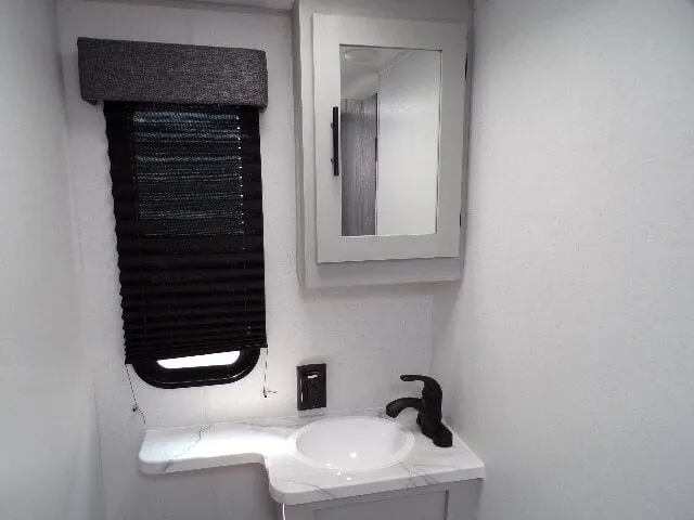 Bathroom with a sink and medicine cabinet.