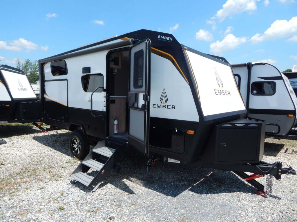 Side view of the RV with entry door.