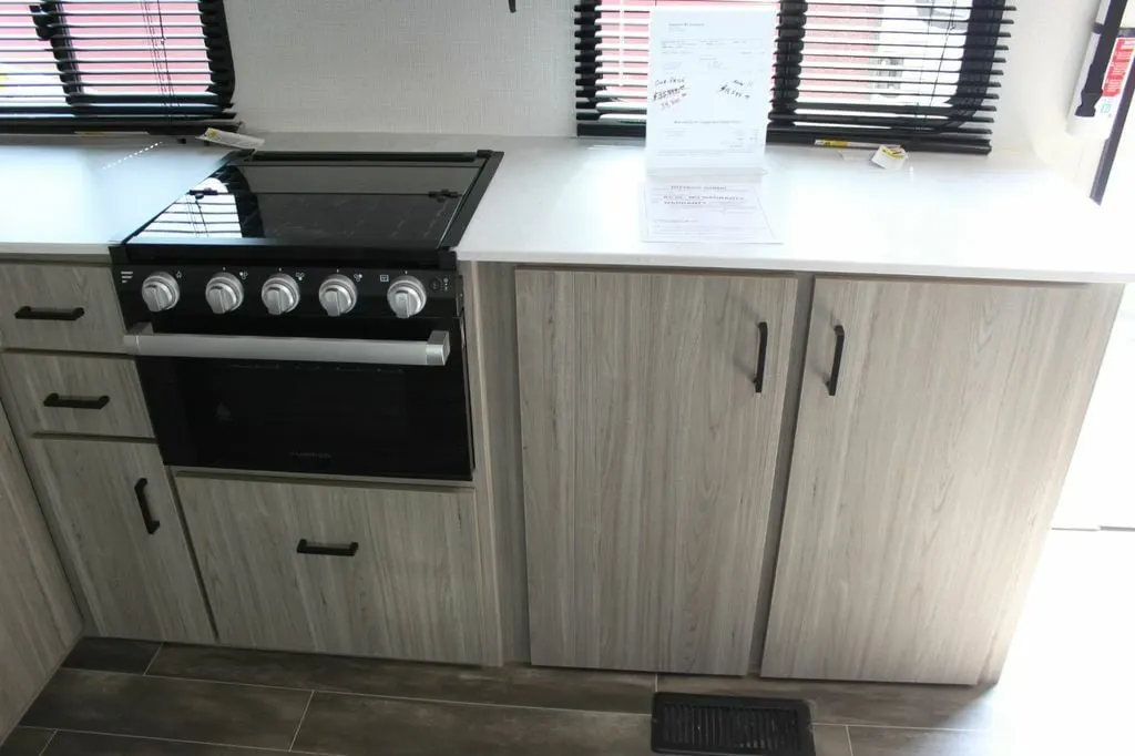 Kitchen with a gas burner and cabinets.