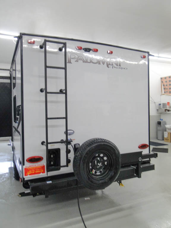 Rear view of the New 2022 Palomino Palomini 189BHS Travel Trailer RV.