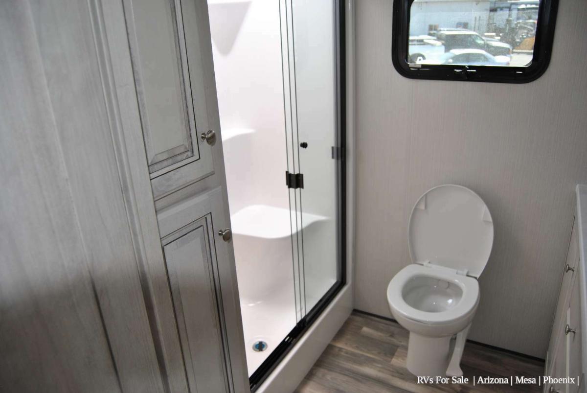 Bathroom with a toilet and a walk-in shower.