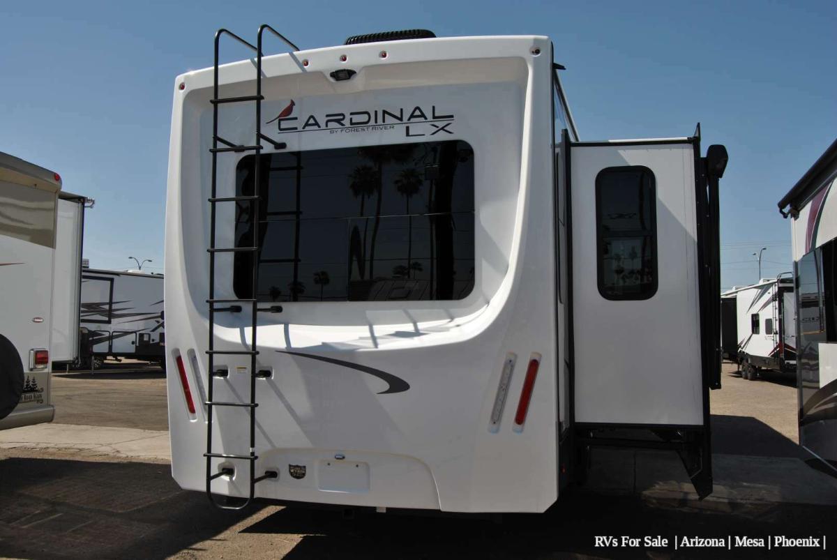 Rear view of the RV with a slide out.