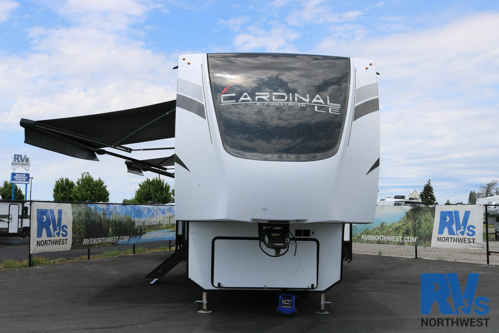 Front view of the RV with awnings.