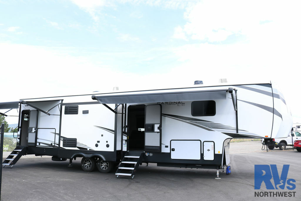 Side view of the RV with awnings.