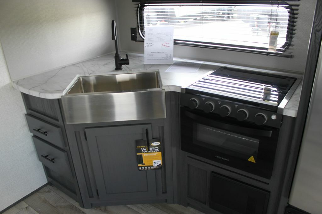 Kitchen sink and gas burner.