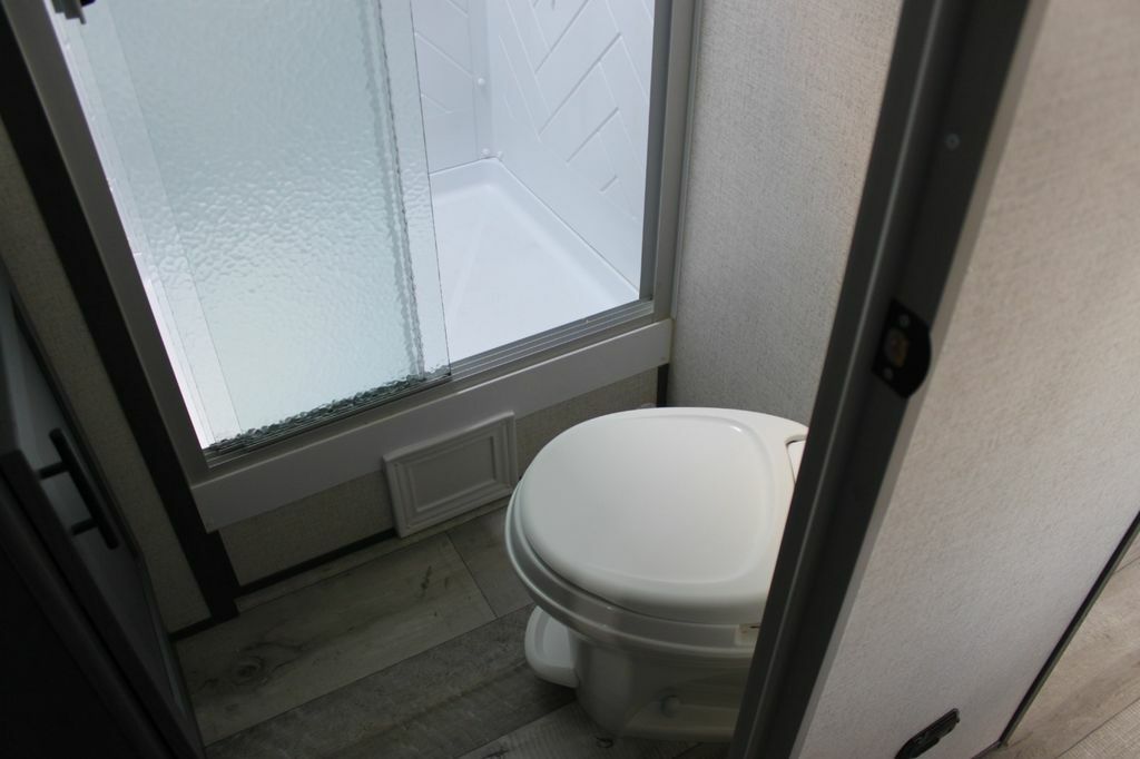 Bathroom with a toilet and a walk-in shower.