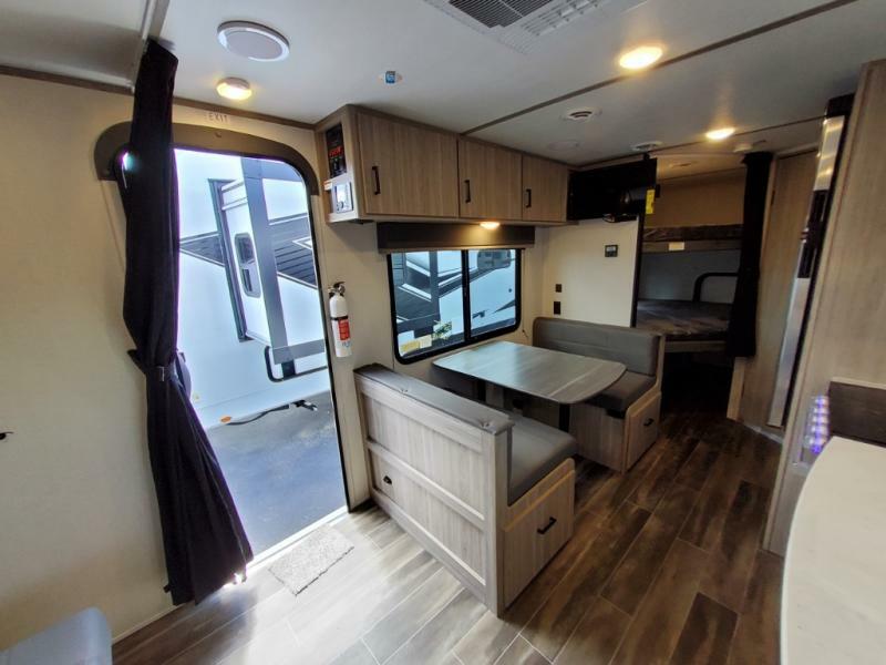 Dinette with overhead cabinets.