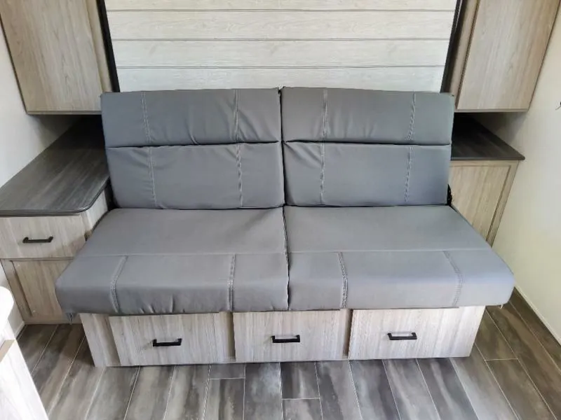 Living space with leather seats and drawers. 