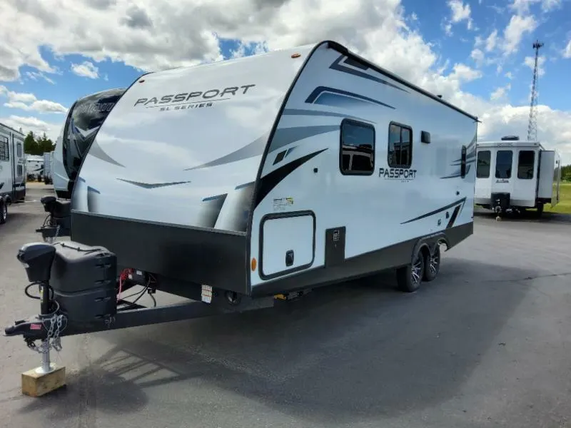 Side view of the New 2022 Keystone Rv Passport SL 219BH Travel Trailer RV.