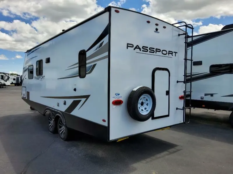 Side view of the New 2022 Keystone Rv Passport SL 219BH Travel Trailer RV.