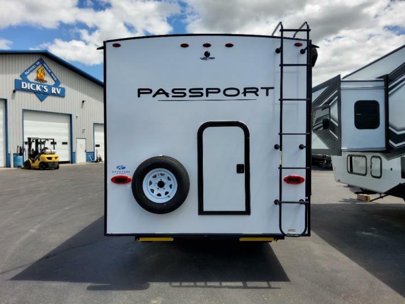 Rear view of the New 2022 Keystone Rv Passport SL 219BH Travel Trailer RV.