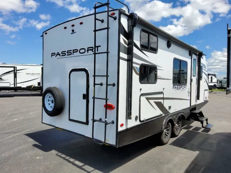 Side view of the New 2022 Keystone Rv Passport SL 219BH Travel Trailer RV.