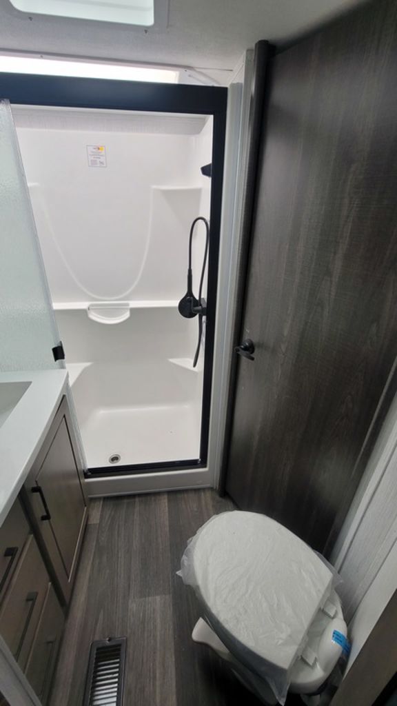 Bathroom with a toilet and a walk-in shower.