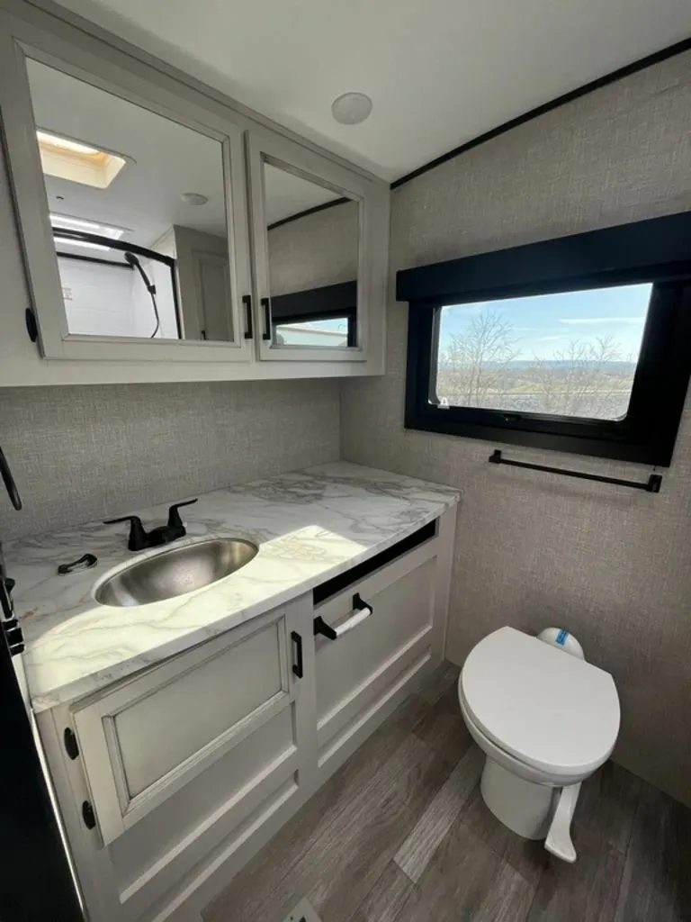 Bathroom with a sink and a toilet.