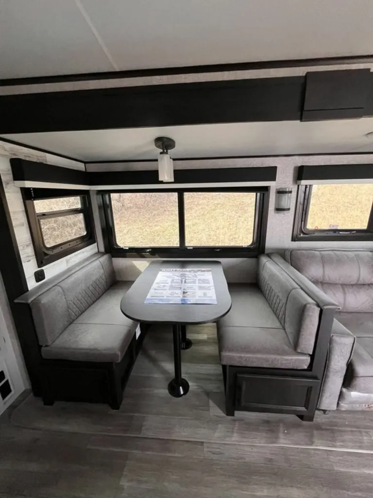 Dinette flanked by leather seats.