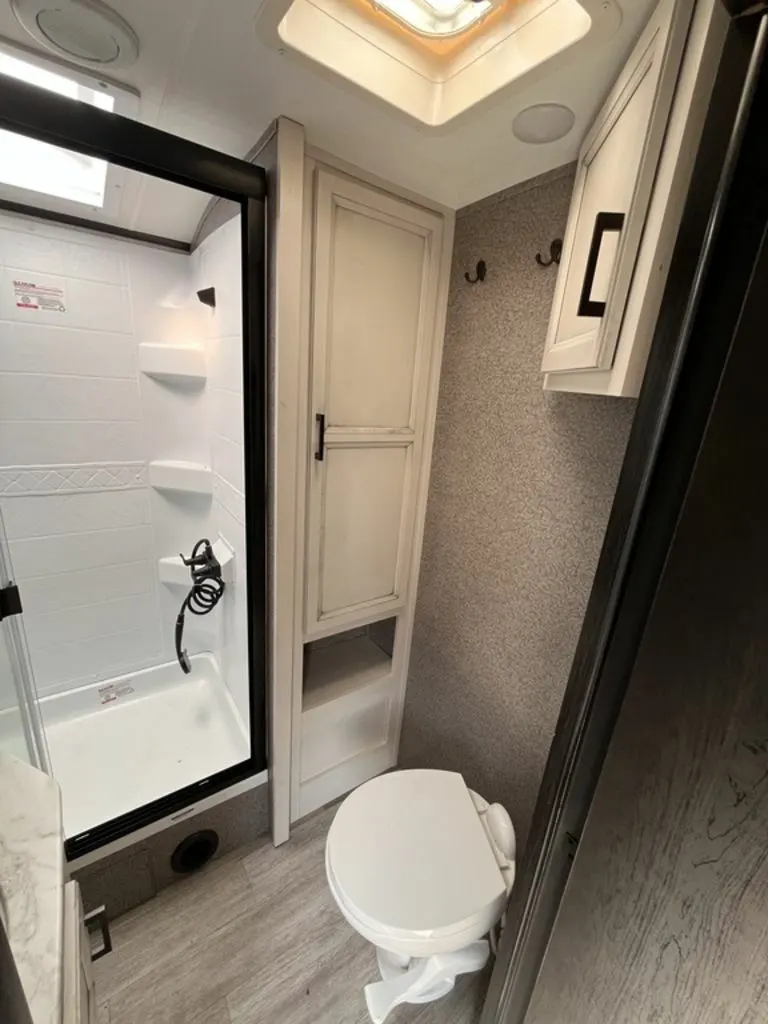 Bathroom with a toilet and a walk-in shower.