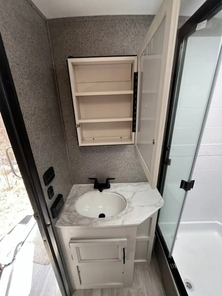 Bathroom with a sink and a medicine cabinet.