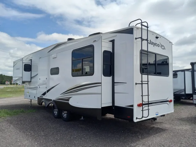 Side view of the RV with slide outs.