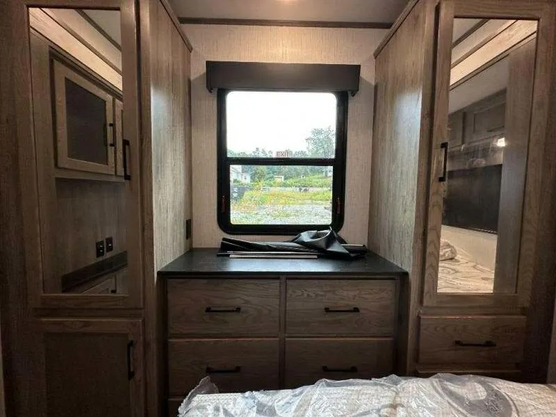 Bedroom with a king size bed and a closet.