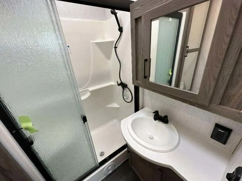 Bathroom with a sink and a walk-in shower.