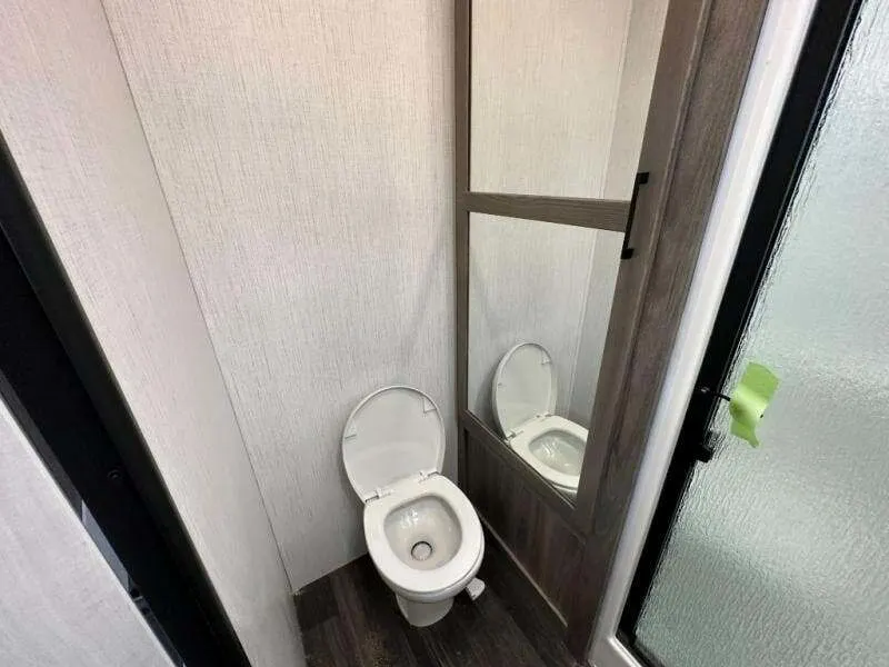 Bathroom with a toilet and a walk-in shower.