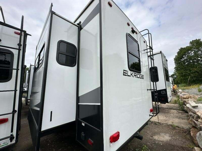 Rear view of the RV with a slide out.