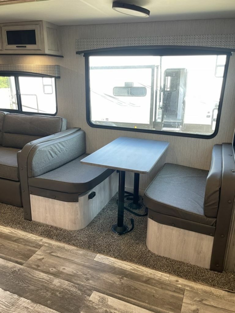 Dinette flanked by leather seats.