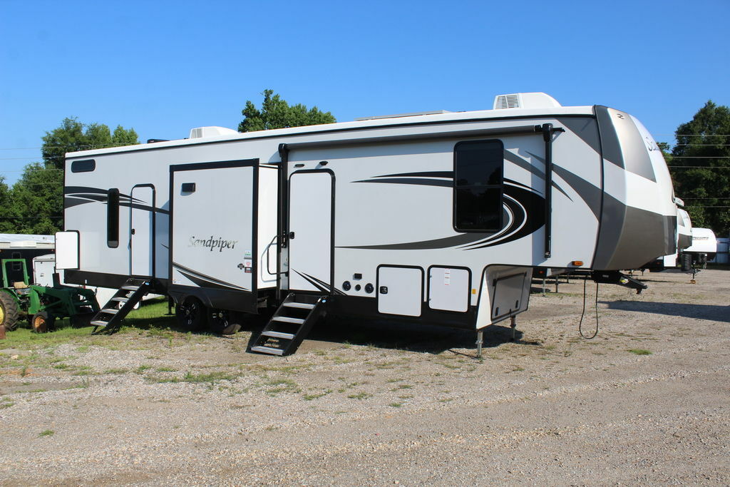 Side view of the New 2022 Forest River Sandpiper 3440BH Fifth Wheel RV.