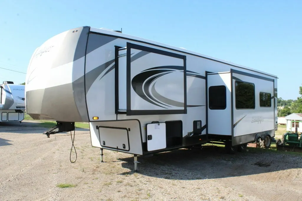 Side view of the RV with slide outs.