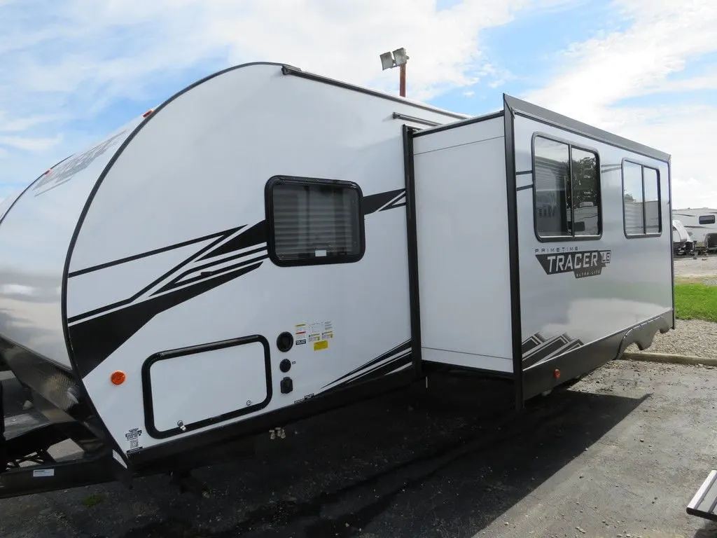 Side view of the New 2022 Prime Time Tracer LE 260BHSLE Travel Trailer RV.