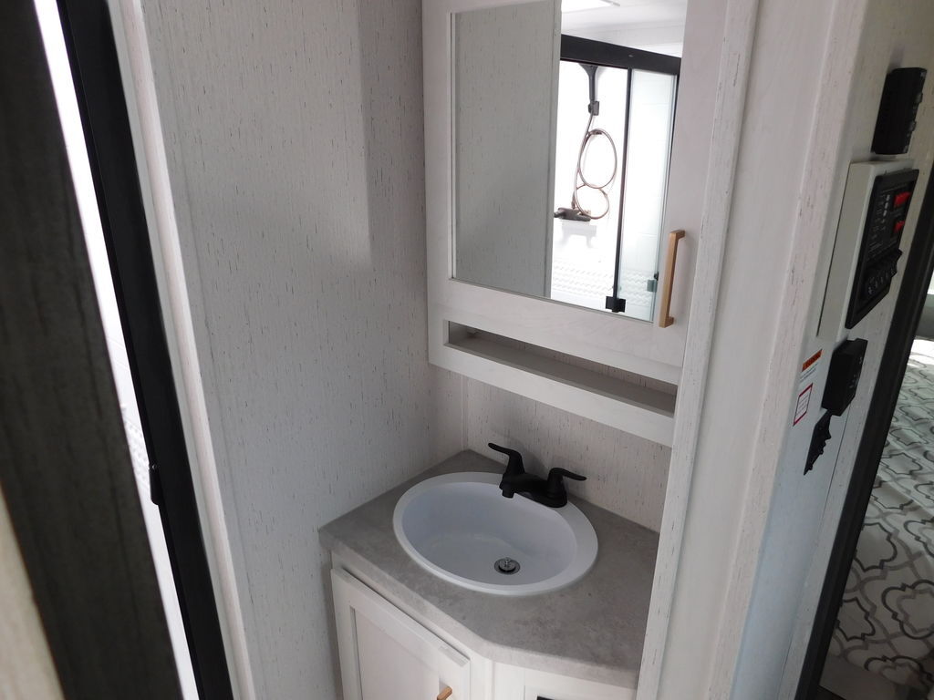 Bathroom sink and a medicine cabinet.