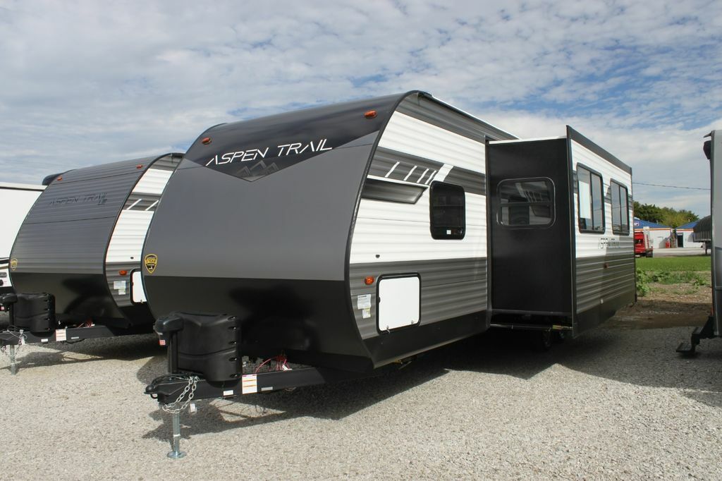 Side view of the RV with a slide out.