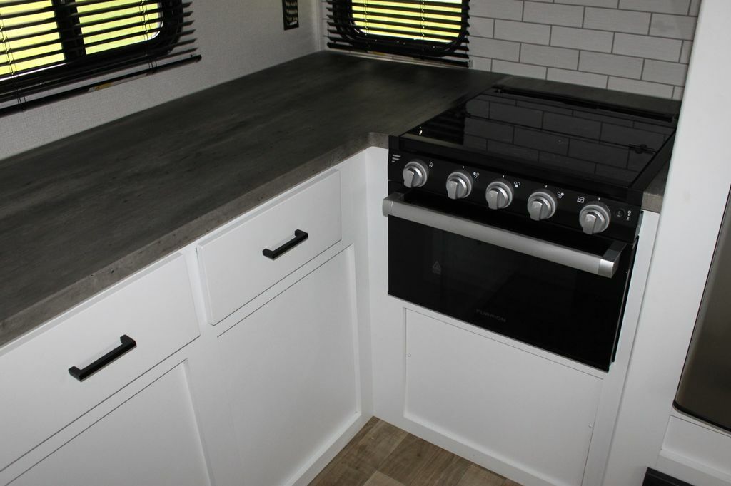 Kitchen with a gas burner and drawers.