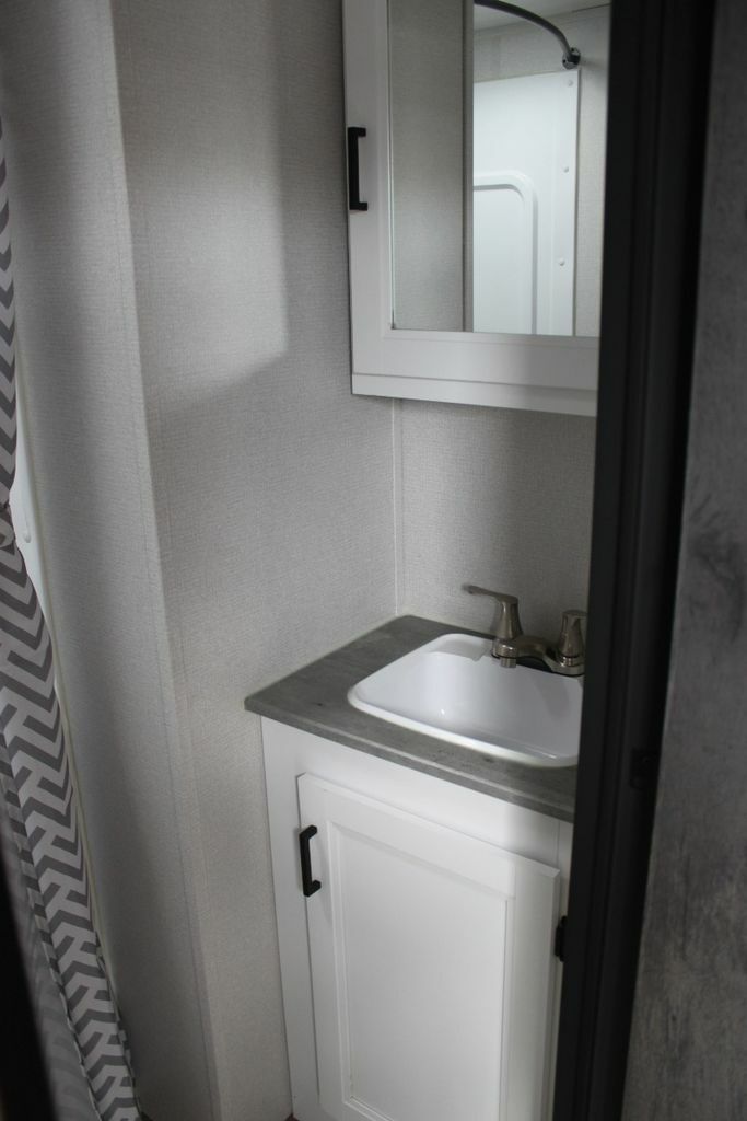 Bathroom with a sink and medicine cabinet.