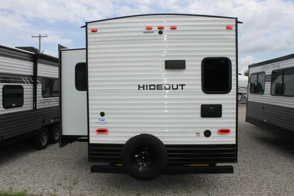 Rear view of the RV with a slide out.