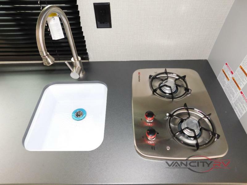 Kitchen with a gas burner and a sink.