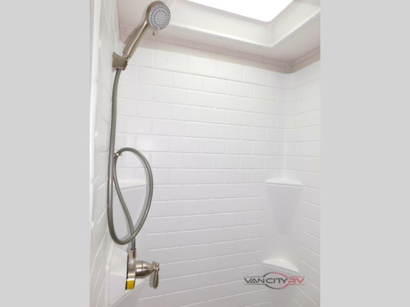 Bathroom with a shower and skylight.