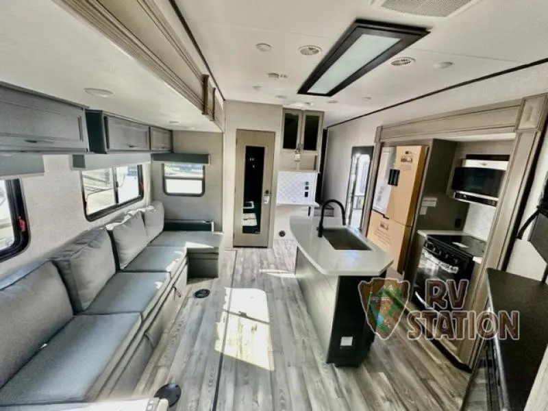 Interior view of the RV with a living space and a kitchen.