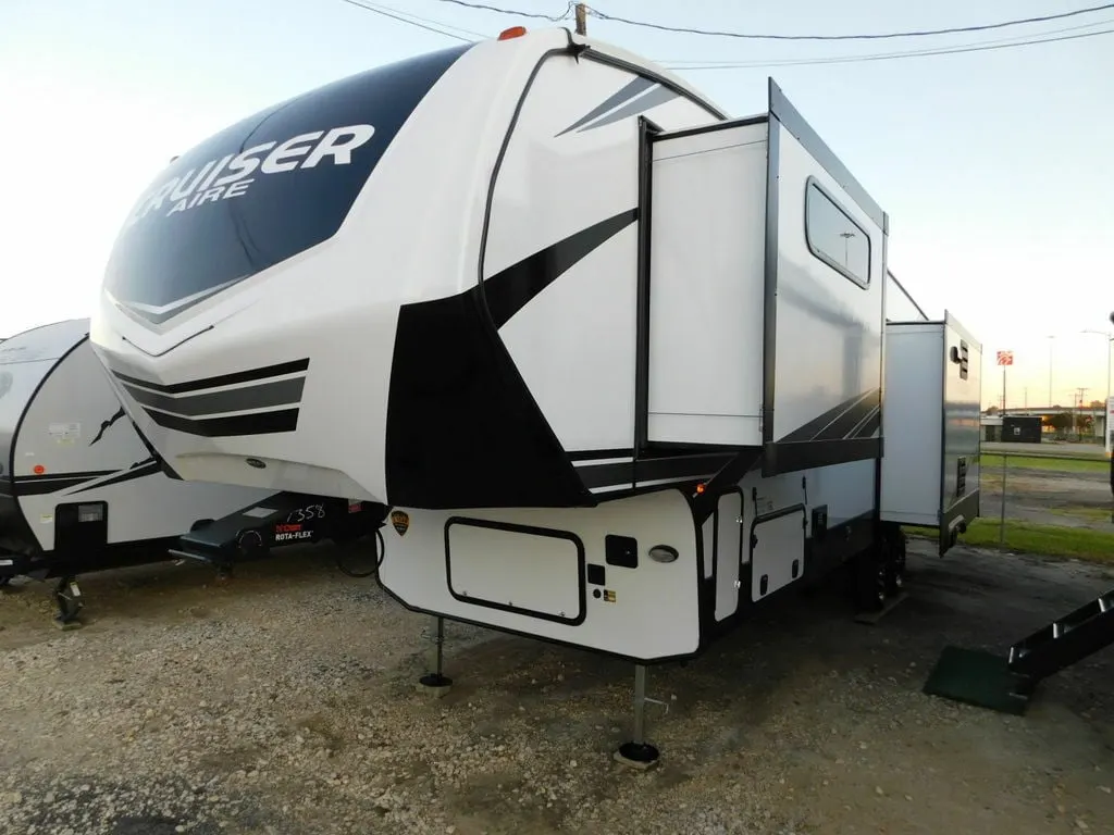 Side view of the RV with slide outs.