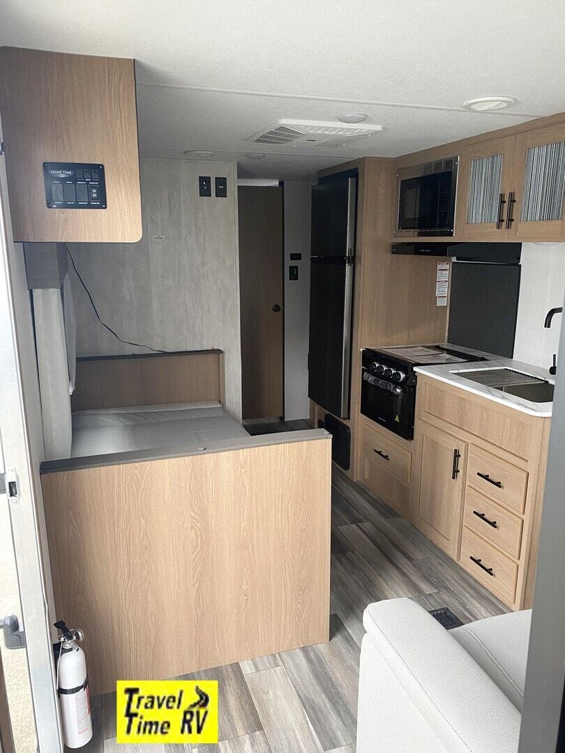 Kitchen with a gas range, fridge, oven, sink and cabinets.