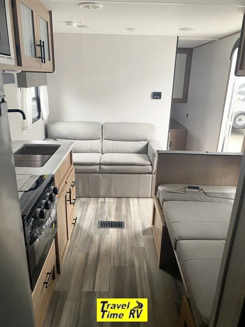 Interior view of the RV with a living space and a kitchen.