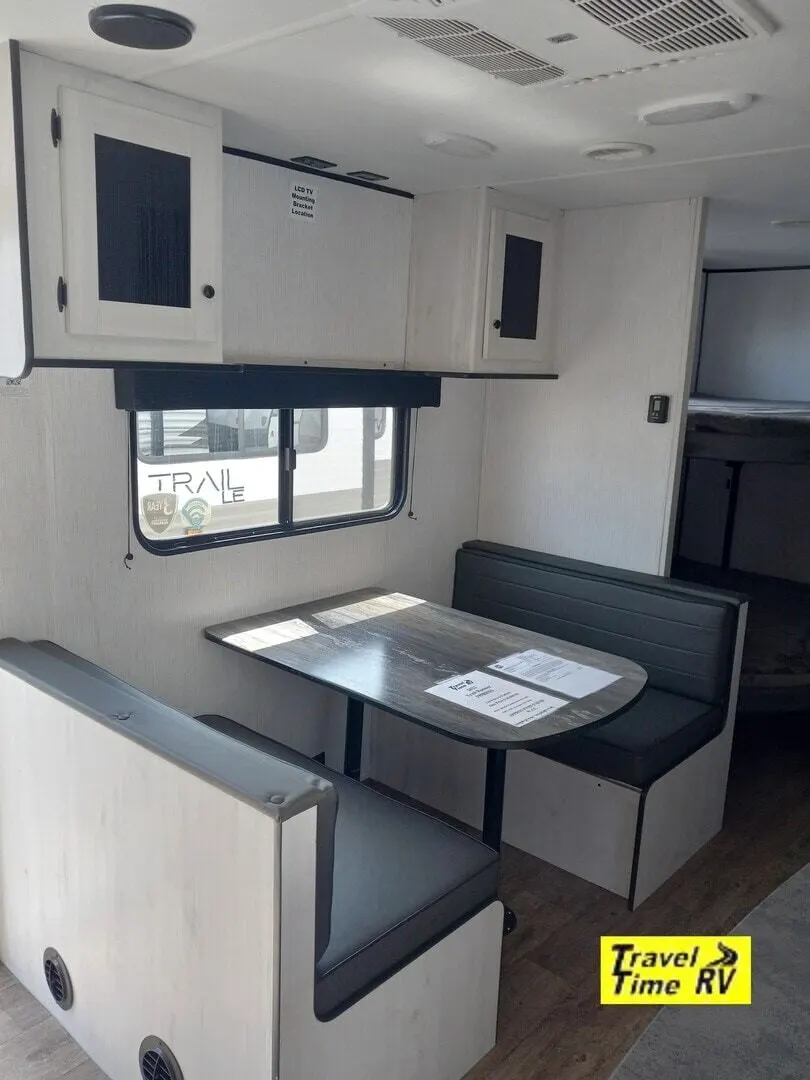 Dinette with overhead cabinets.