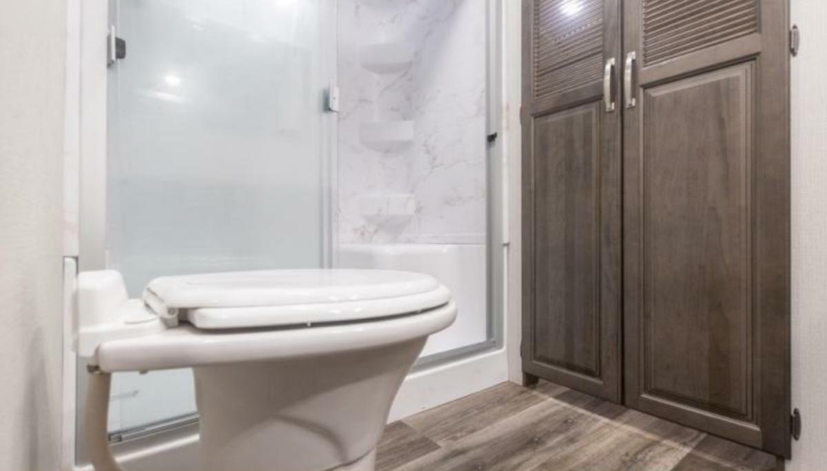 Bathroom with a toilet and a walk-in shower.