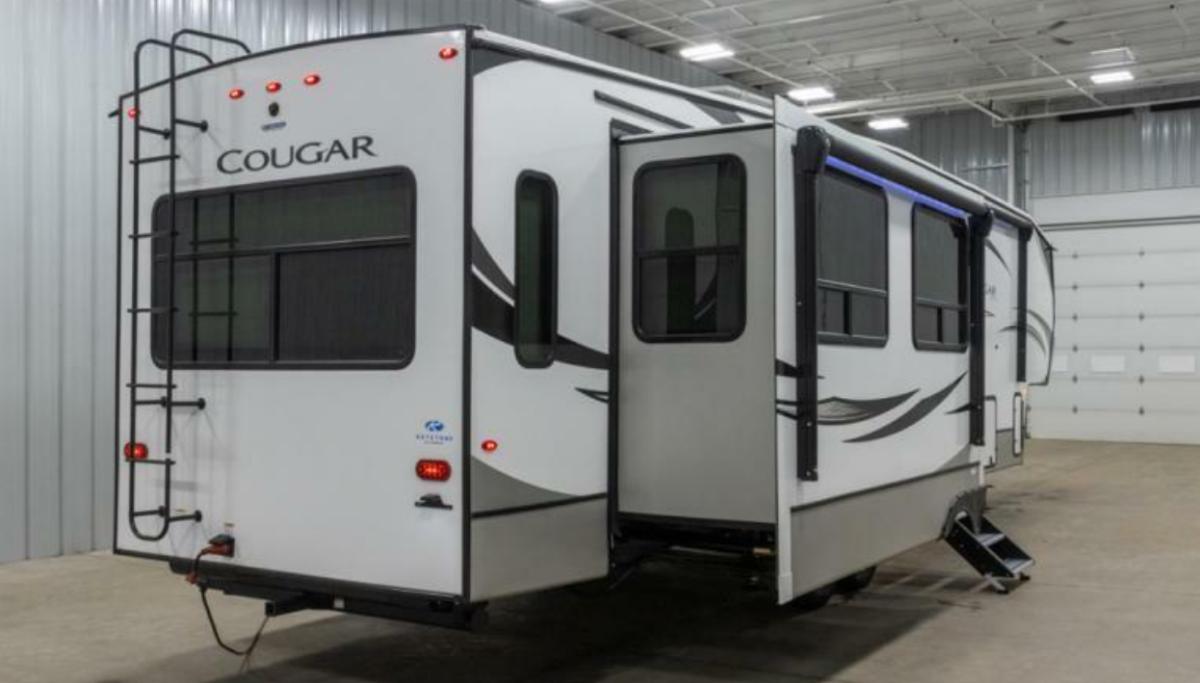 Side view of the New 2022 Keystone Rv Cougar 355FBS Fifth Wheel RV.