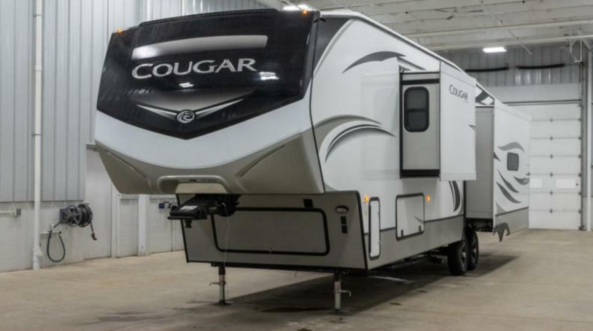 Side view of the New 2022 Keystone Rv Cougar 355FBS Fifth Wheel RV.