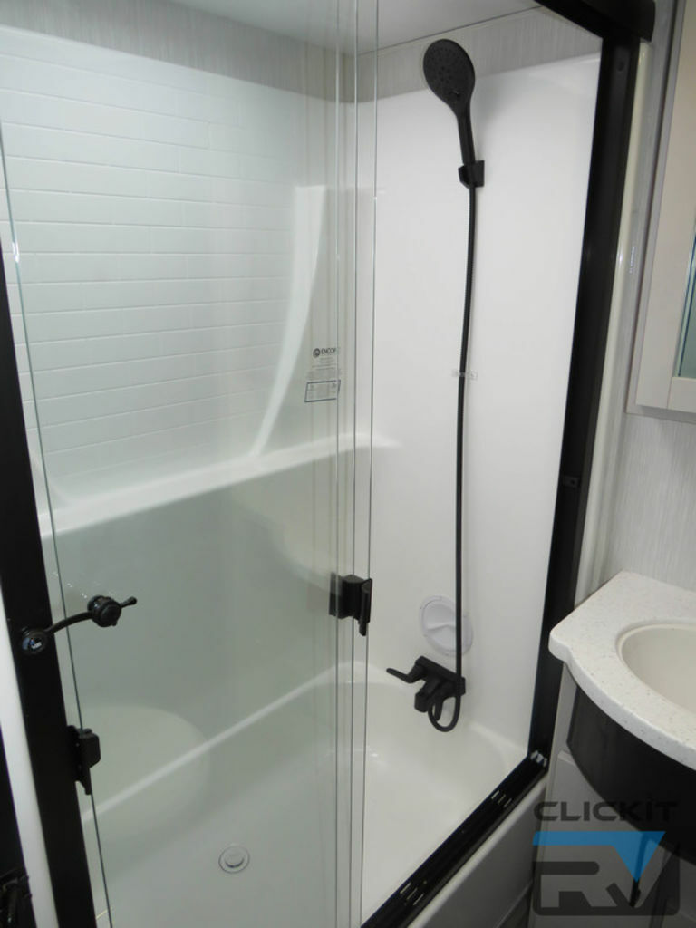 Bathroom with a walk-in shower.